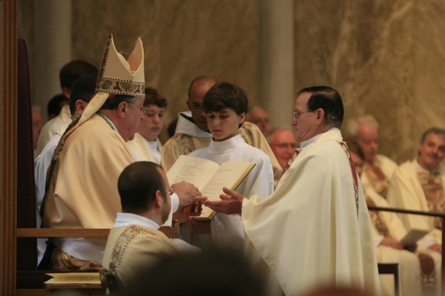 Uncle Roy being ordained as priest
